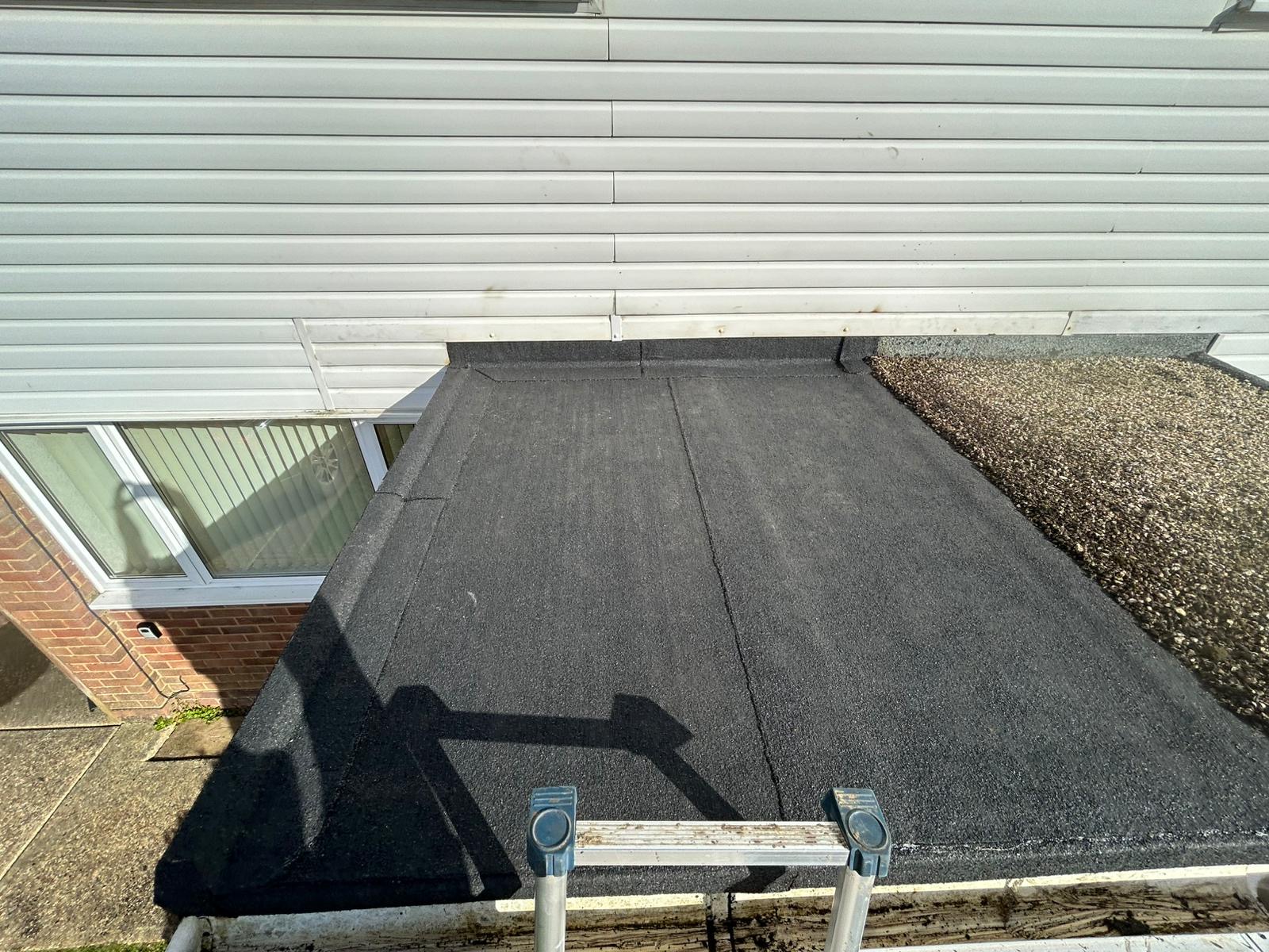 Recently resurfaced flat roof on a residential home