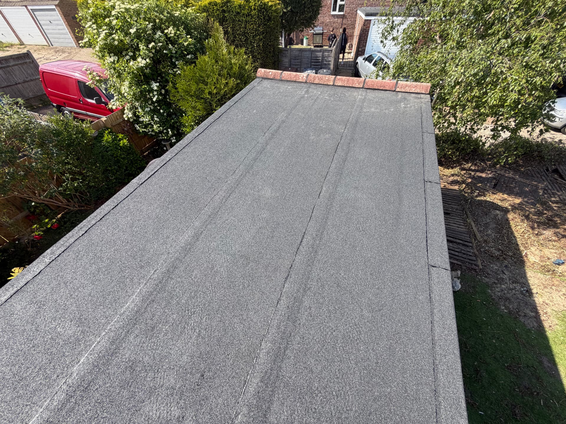 New felt flat roof on a garage completed by JP Roofing